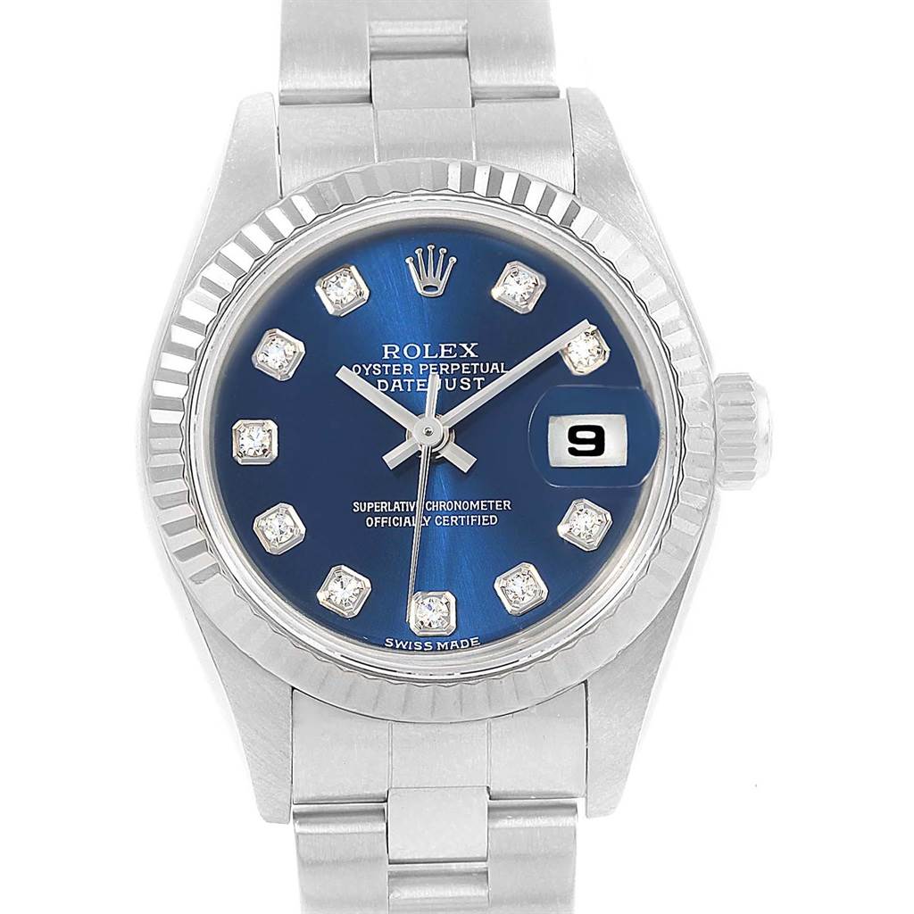 The image shows a front view of a Rolex Datejust 79174 Women
s Stainless Steel Blue Dial 79174 Women
s Stainless Steel Blue Dial watch with a blue dial and diamond hour markers.