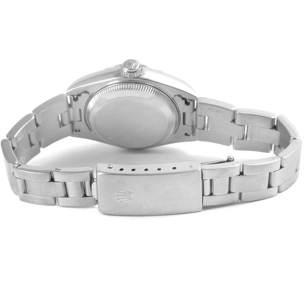 The image shows the back side of the Rolex Datejust 79174 Women
s Stainless Steel Blue Dial 79174 Women
s Stainless Steel Blue Dial watch
s case and bracelet, featuring the clasp and crown.