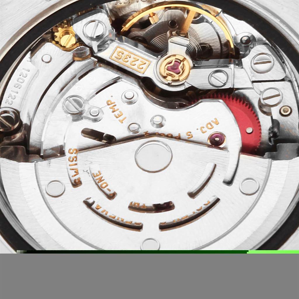 This is a close-up view of the movement inside a Rolex Datejust 79174 Women
s Stainless Steel Blue Dial 79174 Women
s Stainless Steel Blue Dial watch, showing gears and intricate components.