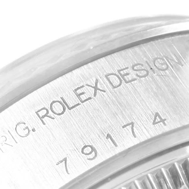 This image shows a close-up of the casing inscription on a Rolex Datejust 79174 Women
s Stainless Steel Blue Dial 79174 Women
s Stainless Steel Blue Dial model.
