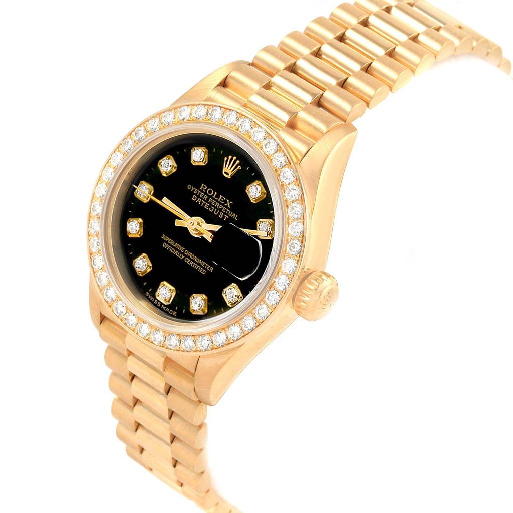This image shows a Rolex Datejust 79138 Women's Yellow Gold Black Dial 79138 Women's Yellow Gold Black Dial watch angled from the top right, highlighting the face, bezel, crown, and bracelet.
