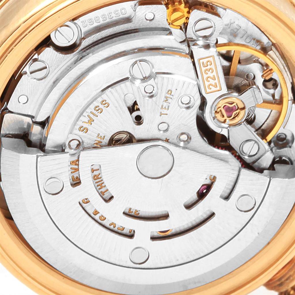 This is a close-up view of the internal mechanism of a Rolex Datejust 79138 Women's Yellow Gold Black Dial 79138 Women's Yellow Gold Black Dial watch, showing the movement and parts with model number 2235.