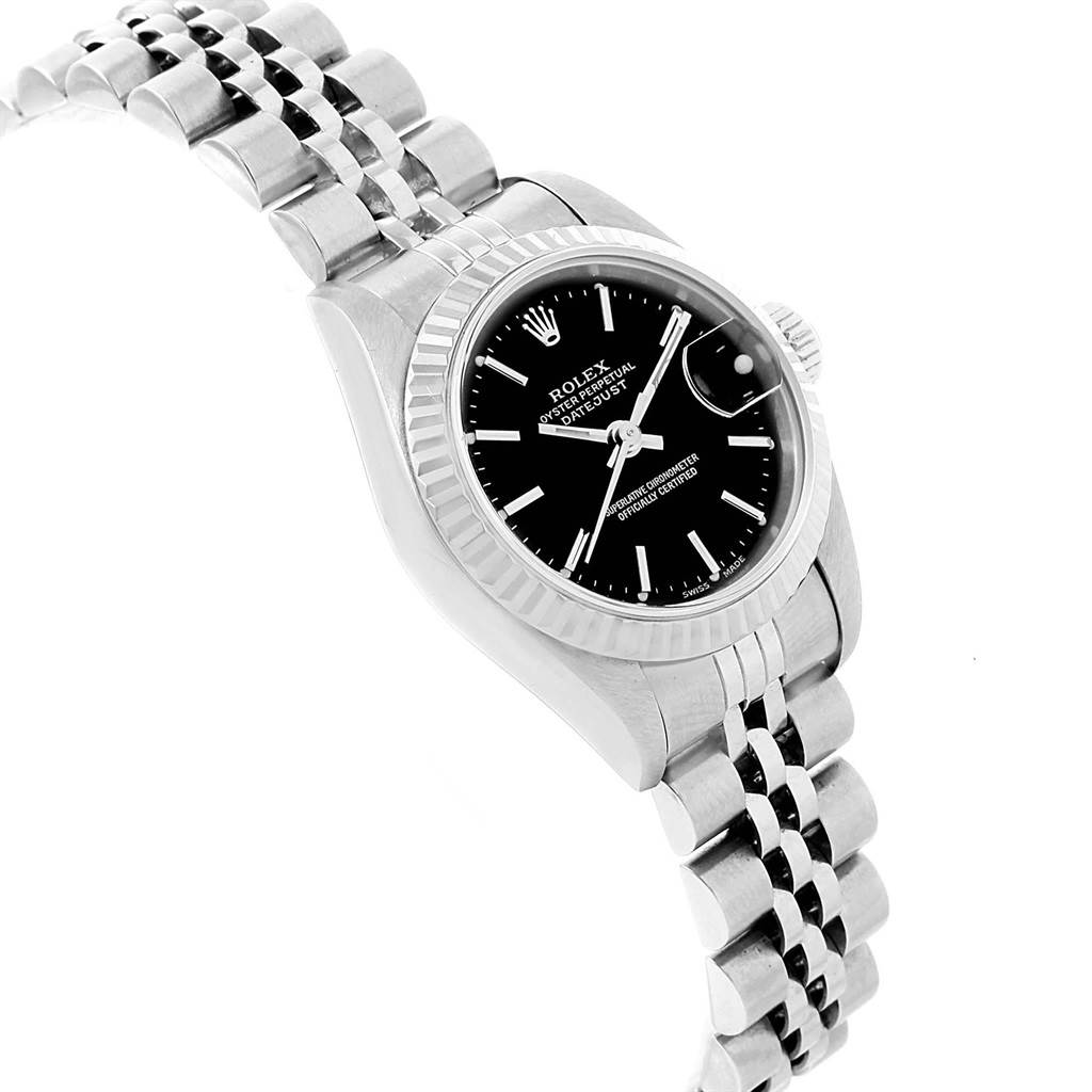 The Rolex Datejust 79174 Women's Stainless Steel Black Dial 79174 Women's Stainless Steel Black Dial watch is shown at a tilted angle, displaying the case, dial, and part of the bracelet.