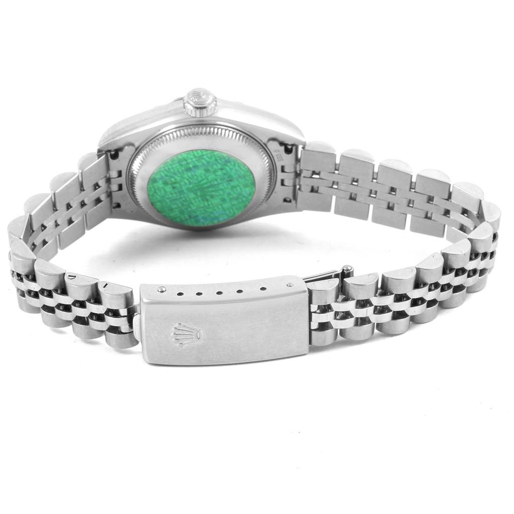 This image shows the backside of a Rolex Datejust 79174 Women's Stainless Steel Black Dial 79174 Women's Stainless Steel Black Dial watch, highlighting the case back, crown, and bracelet clasp.