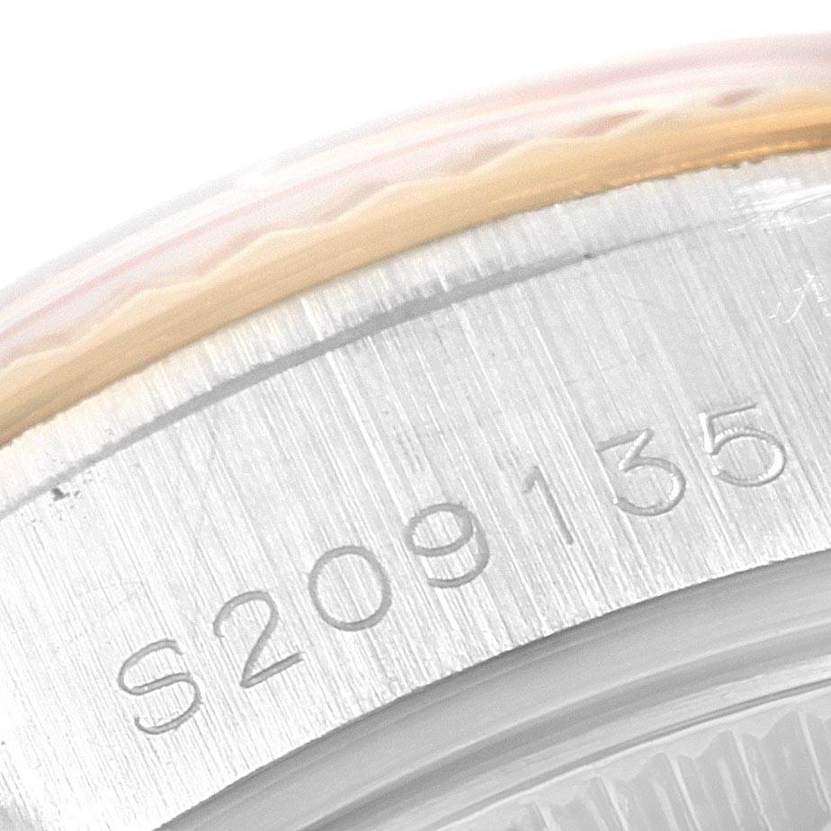 This image shows a close-up of the serial number engraved on the side of a Rolex Datejust 69173 Women's Stainless Steel Champagne Dial 69173 Women's Stainless Steel Champagne Dial watch case.