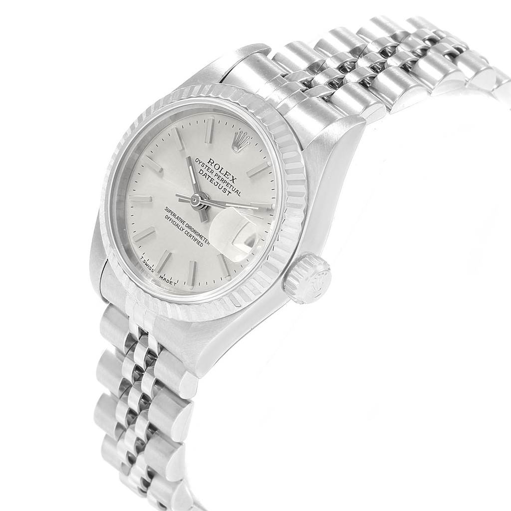 The image shows a side-angle view of a Rolex Datejust 69174 Women's Stainless Steel Silver Dial 69174 Women's Stainless Steel Silver Dial watch, highlighting its dial, fluted bezel, and Jubilee bracelet.