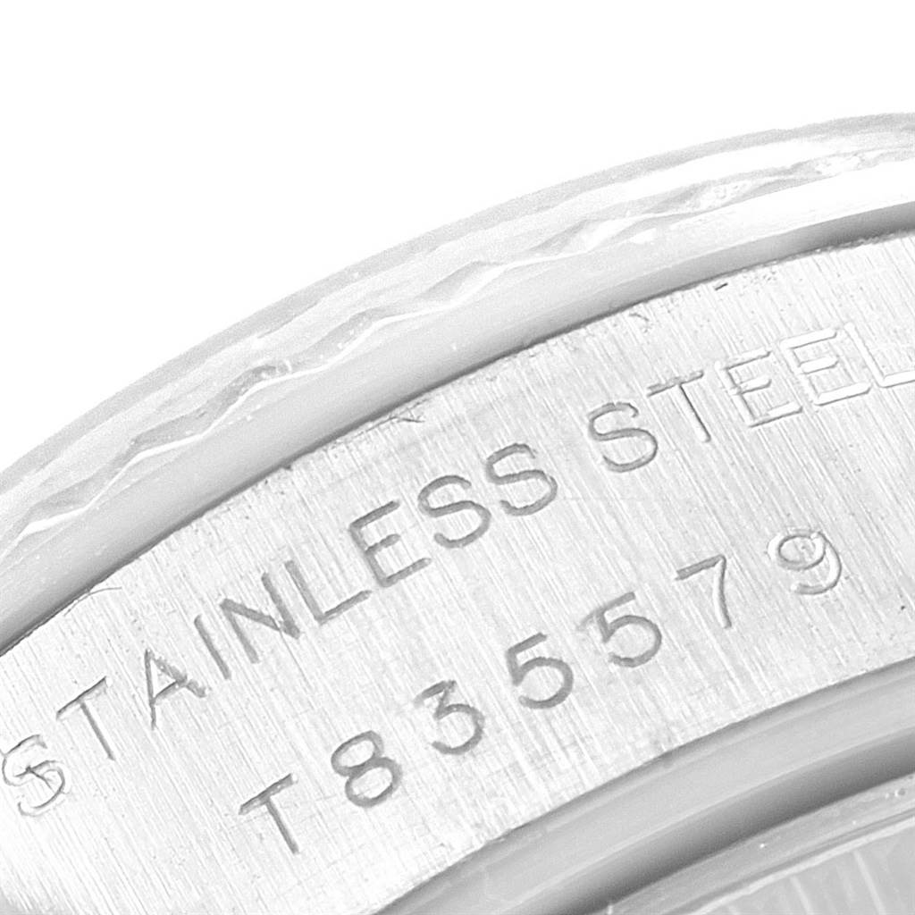 This image shows a close-up of the stainless steel back casing of a Rolex Datejust 69174 Women's Stainless Steel Silver Dial 69174 Women's Stainless Steel Silver Dial watch, highlighting the serial number and metal type.