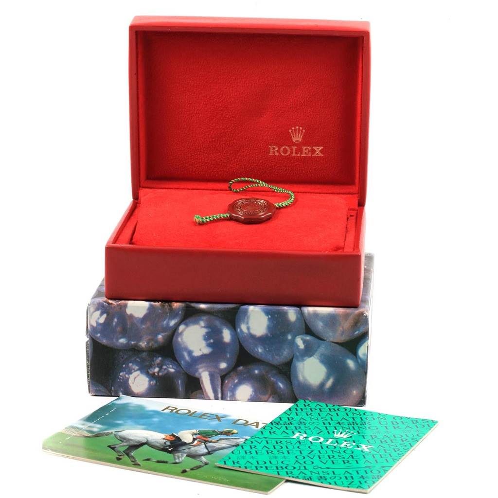 The image shows a Rolex Datejust 69174 Women's Stainless Steel Silver Dial 69174 Women's Stainless Steel Silver Dial watch box, with a tag inside and accompanying booklets outside the box.
