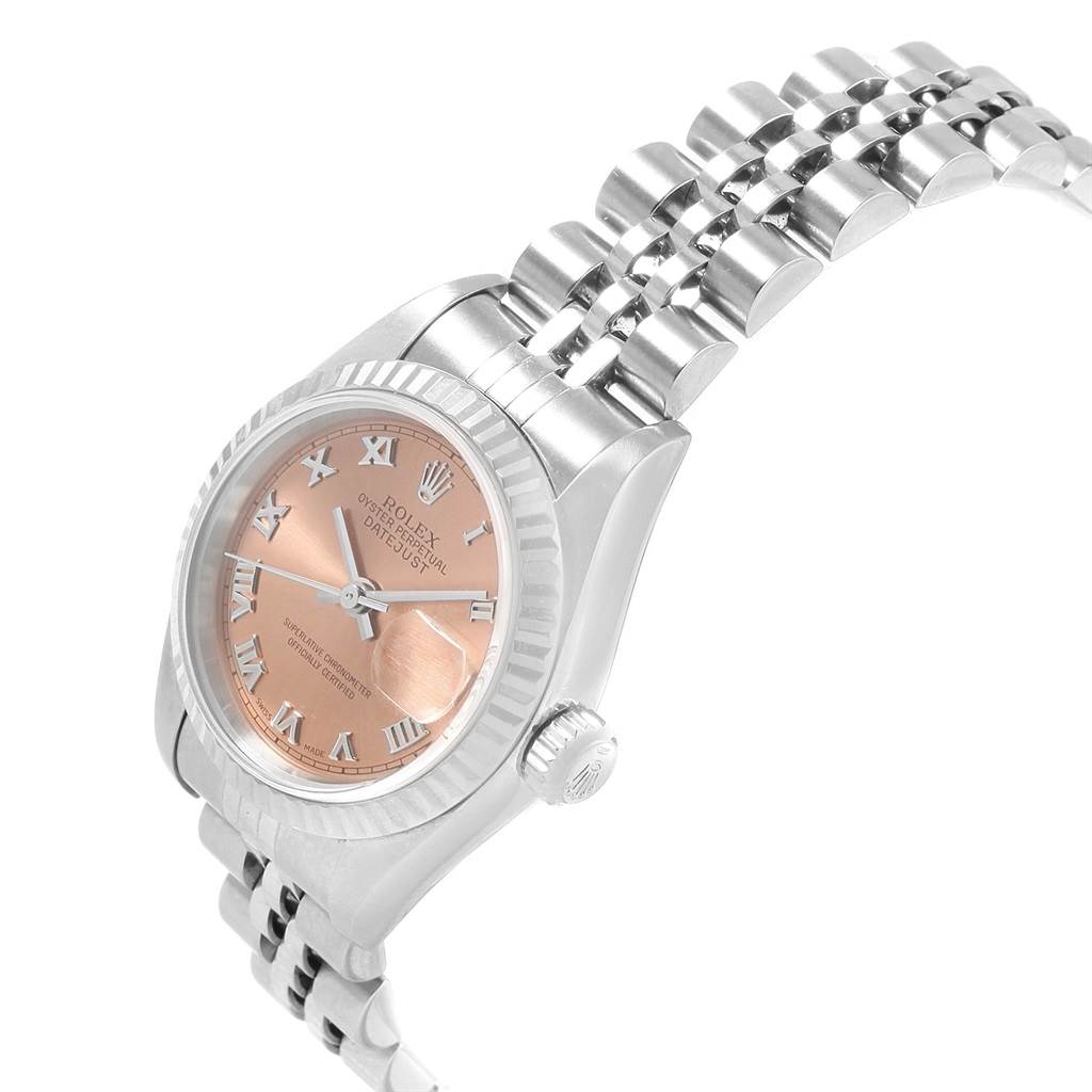 This image shows a Rolex Datejust 79174 Women's Stainless Steel Pink Dial 79174 Women's Stainless Steel Pink Dial watch at an angle displaying its face, bezel, crown, and part of the bracelet.
