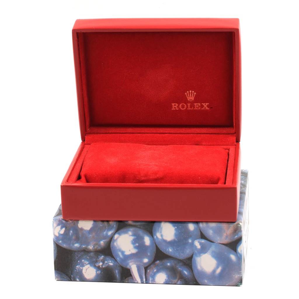 The image shows an open red Rolex watch box for a Datejust model, with no watch inside.