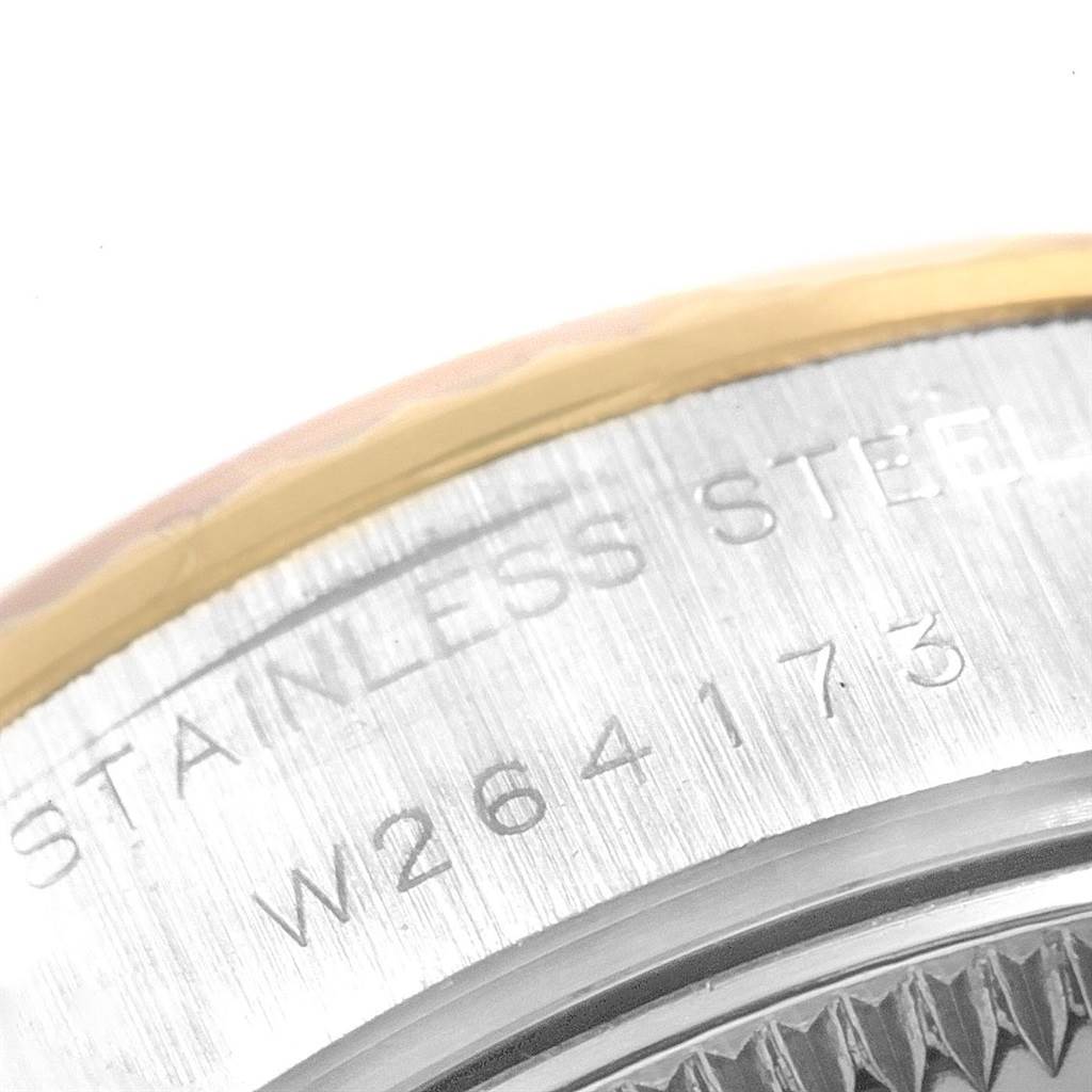 The image shows a close-up of the case back with engravings on a Rolex Datejust 69173 Women
s Stainless Steel Champagne Dial 69173 Women
s Stainless Steel Champagne Dial watch.