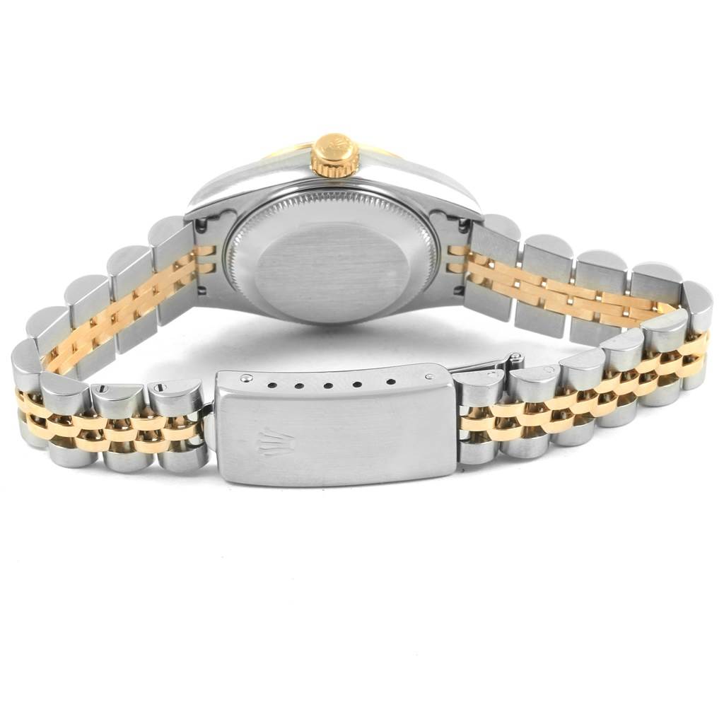 The image shows the back view of a Rolex Datejust 69173 Women
s Stainless Steel Champagne Dial 69173 Women
s Stainless Steel Champagne Dial watch, highlighting its case back, crown, and bi-metal bracelet with a clasp.