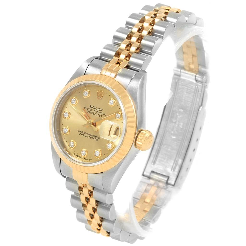 The image shows a side angle of a Rolex Datejust 69173 Women
s Stainless Steel Champagne Dial 69173 Women
s Stainless Steel Champagne Dial watch, featuring a two-tone metal bracelet and a gold dial.