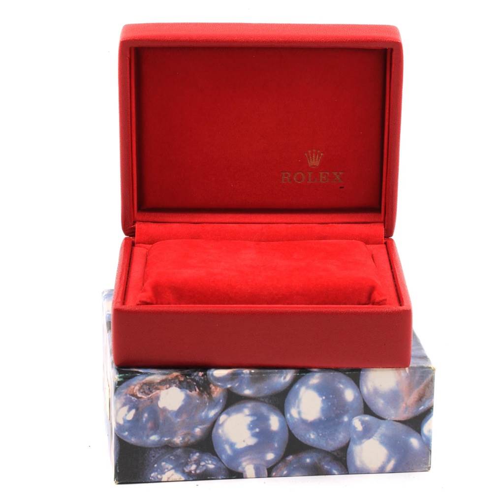 The image shows a red Rolex watch box with the lid open, designed for the Datejust model.