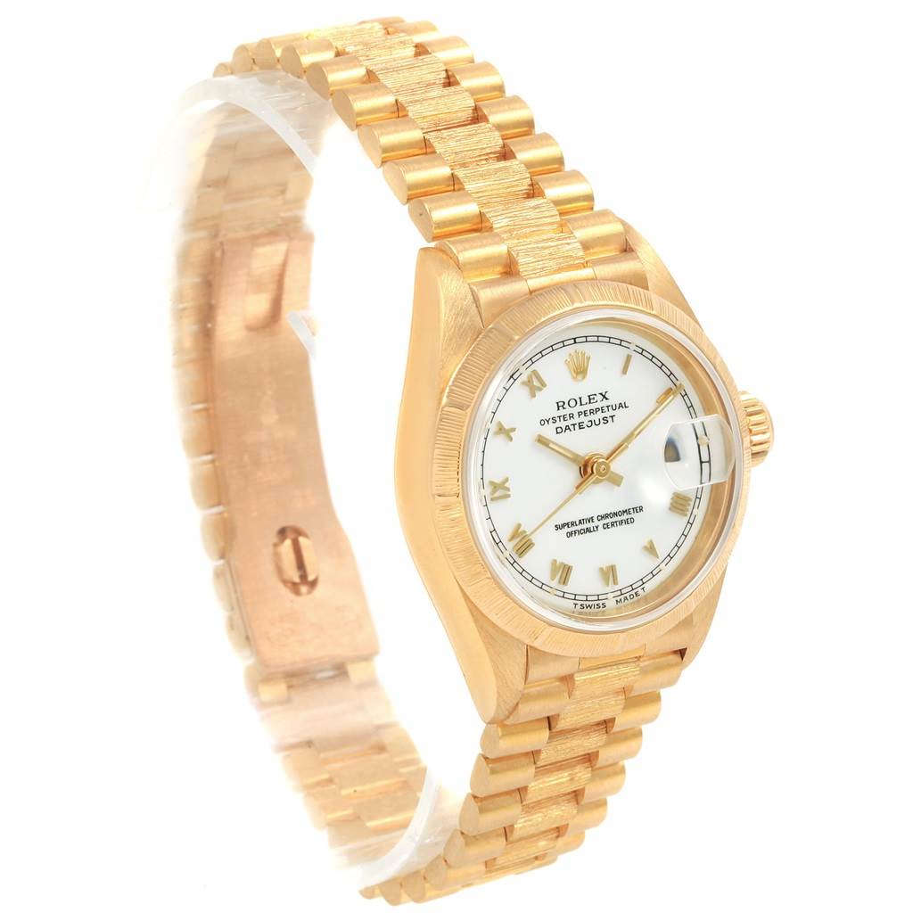 The image shows a side-angle view of a gold Rolex Datejust 69278 Women's Yellow Gold White Dial 69278 Women's Yellow Gold White Dial watch, highlighting the dial and bracelet.