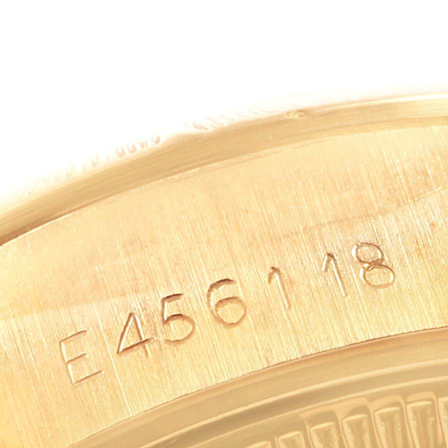 This image shows a close-up of the serial number engraving on the case side of a Rolex Datejust 69278 Women's Yellow Gold White Dial 69278 Women's Yellow Gold White Dial watch.