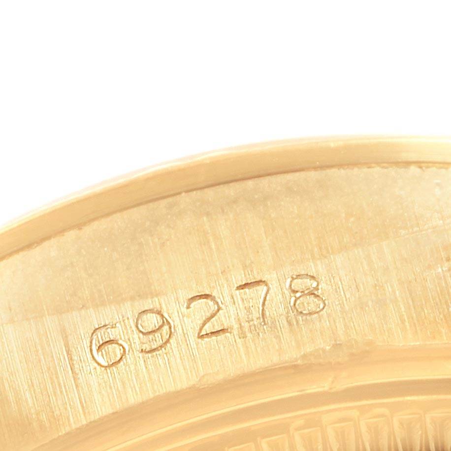 The image shows a close-up of the case number "69278" engraved on a gold Rolex Datejust 69278 Women's Yellow Gold White Dial 69278 Women's Yellow Gold White Dial model.