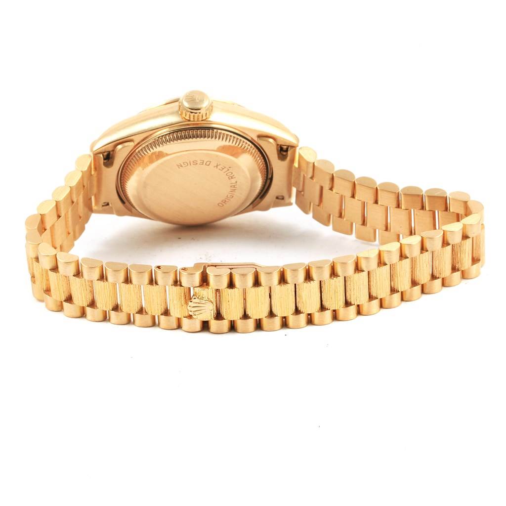 This image shows the backside and band of a Rolex Datejust 69278 Women's Yellow Gold White Dial 69278 Women's Yellow Gold White Dial watch in gold, with the case back and crown visible.