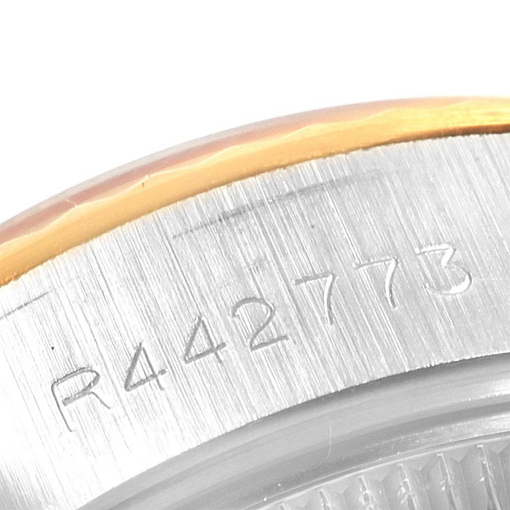 This image shows a close-up of the serial number on the bezel of a Rolex Datejust 69173 Women's Stainless Steel Champagne Dial 69173 Women's Stainless Steel Champagne Dial watch.