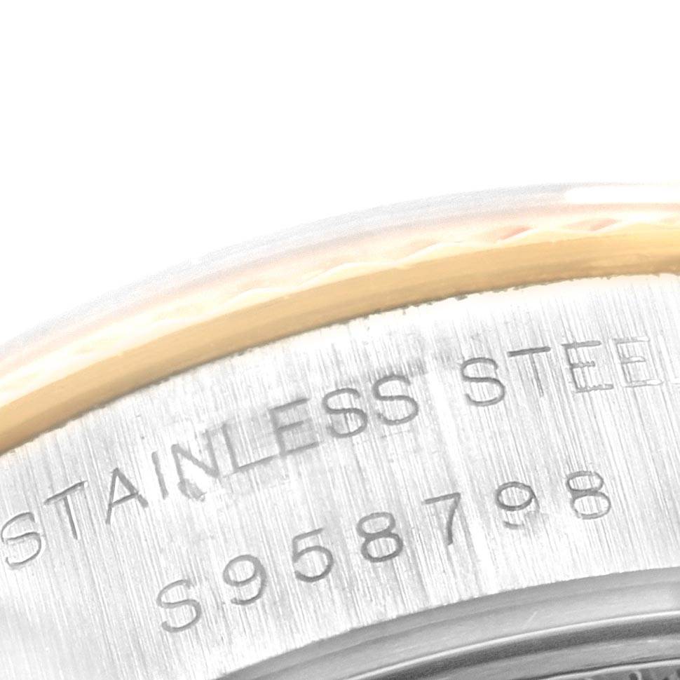 This image shows a close-up of the serial number engraved on the stainless steel back of a Rolex Datejust 69173 Women's Stainless Steel Beige Dial 69173 Women's Stainless Steel Beige Dial watch.