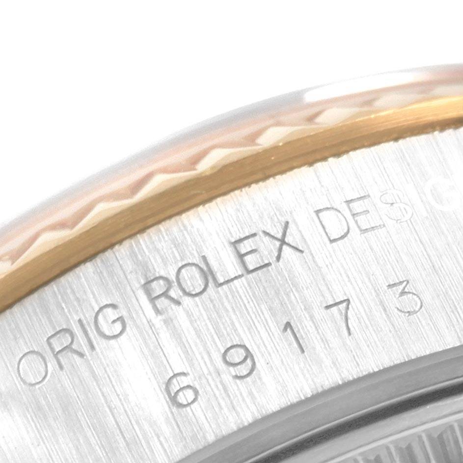 This close-up image shows the engraved text and part of the bezel of the Rolex Datejust 69173 Women's Stainless Steel Beige Dial 69173 Women's Stainless Steel Beige Dial watch.
