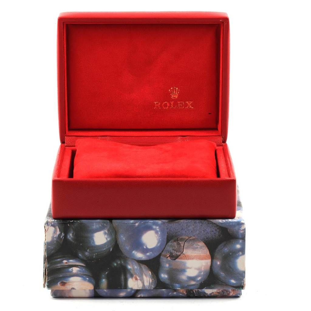 Front view of the red Rolex Datejust 69173 Women's Stainless Steel Beige Dial 69173 Women's Stainless Steel Beige Dial watch box, with the lid open and an empty cushion inside, displaying the brand logo.