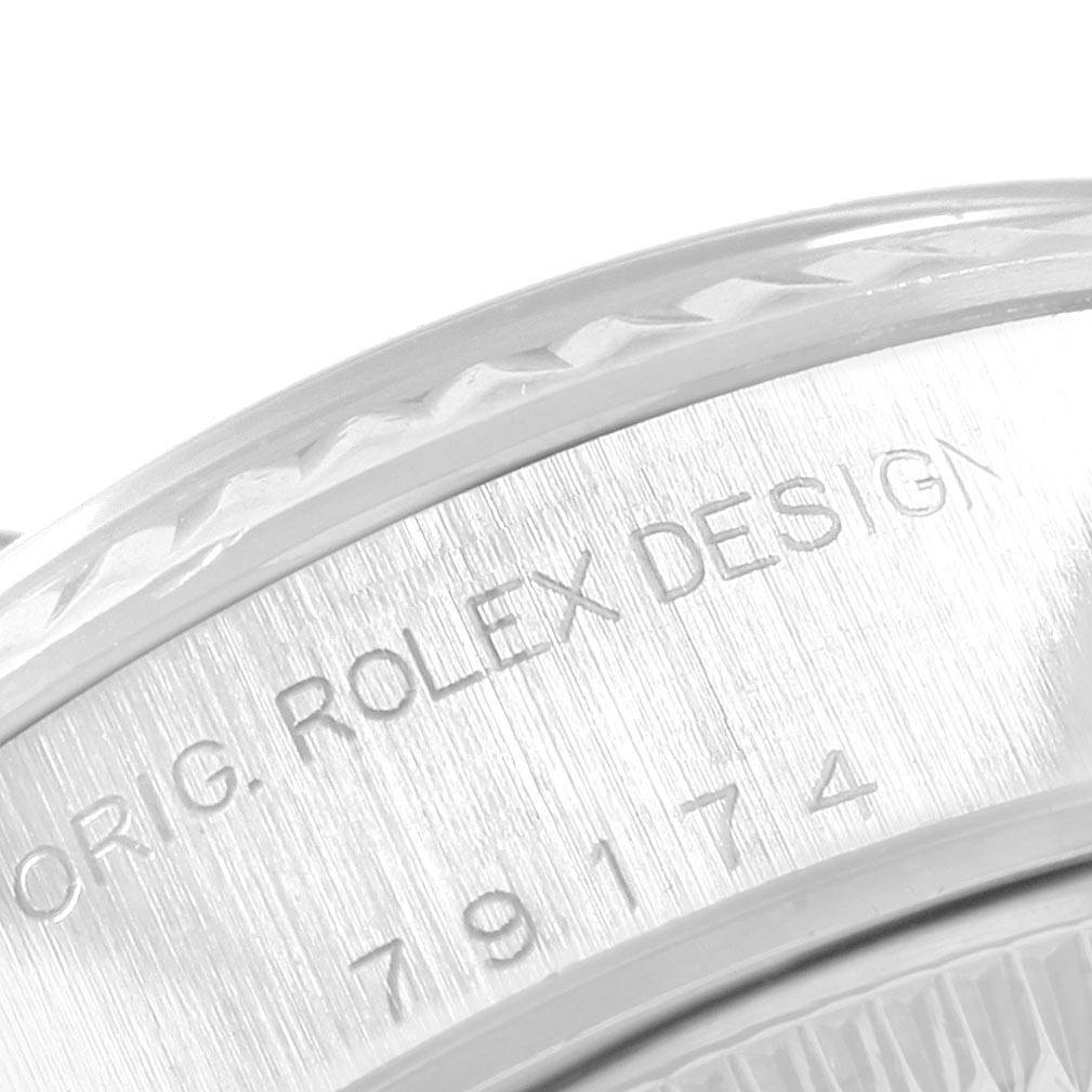This image shows a close-up of the side of the Rolex Datejust 79174 Women
s Stainless Steel Mother of Pearl Dial 79174 Women
s Stainless Steel Mother of Pearl Dial watch case, highlighting the model and design engravings.