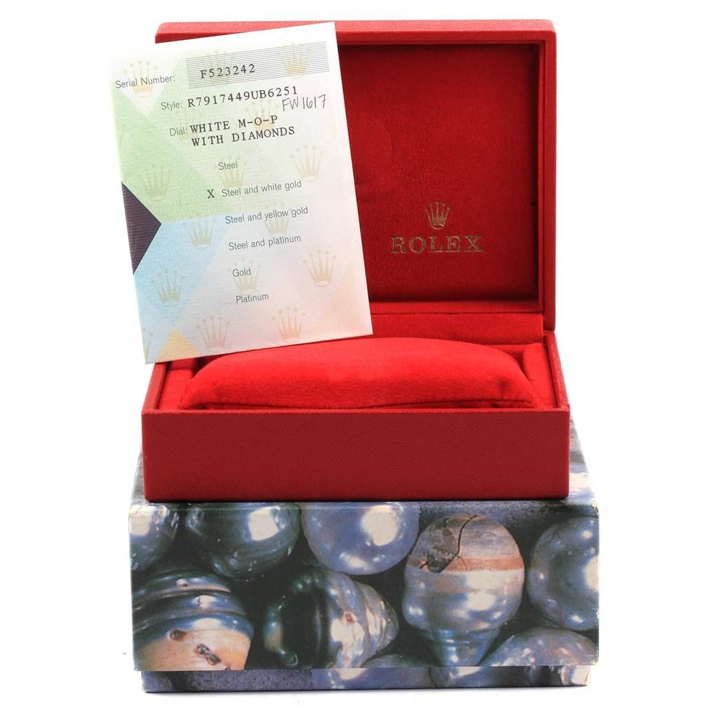 The image shows an empty Rolex Datejust 79174 Women
s Stainless Steel Mother of Pearl Dial 79174 Women
s Stainless Steel Mother of Pearl Dial box with a certificate card inside, revealing the interior and exterior packaging.