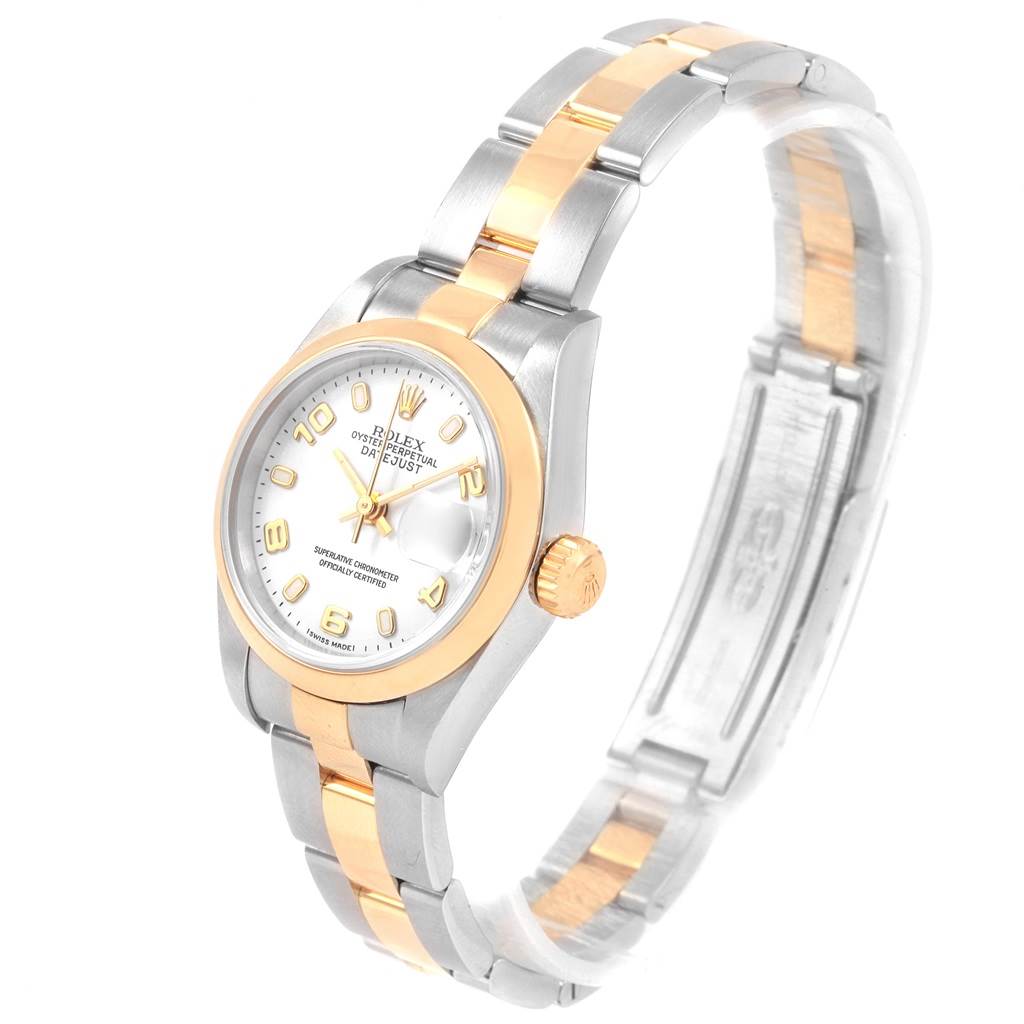 The image shows a Rolex Datejust 79163 Women's Steel and Gold (two tone) White Dial 79163 Women's Steel and Gold (two tone) White Dial watch at an angle that highlights the face, bezel, and bracelet with two-tone metallic links.