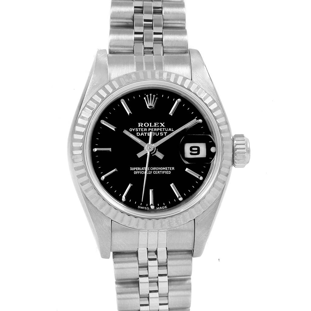 The image shows a Rolex Datejust 79174 Women
s Stainless Steel Black Dial 79174 Women
s Stainless Steel Black Dial watch from a top-down angle, highlighting its black dial, stainless steel bezel, and bracelet.