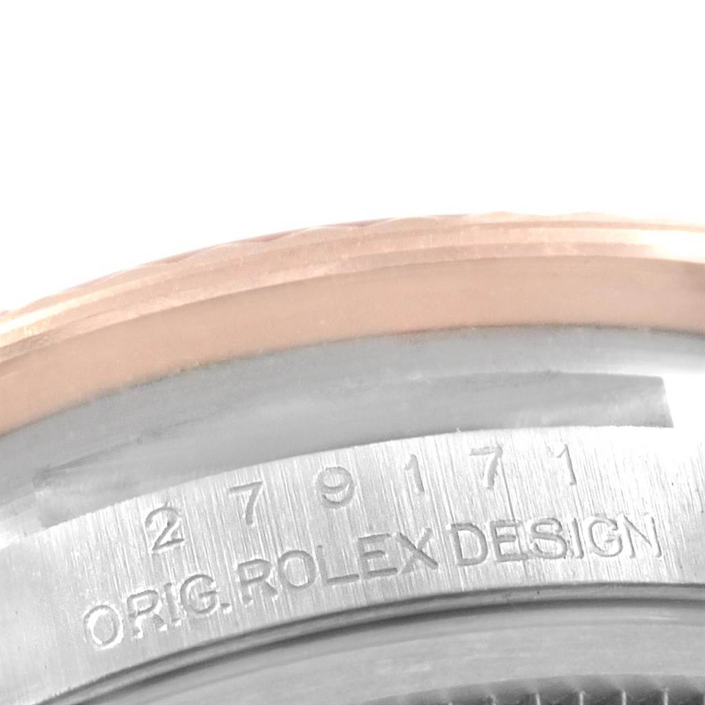 This image shows a close-up of the Datejust model by Rolex, highlighting its serial number and "ORIG. ROLEX DESIGN" inscription.