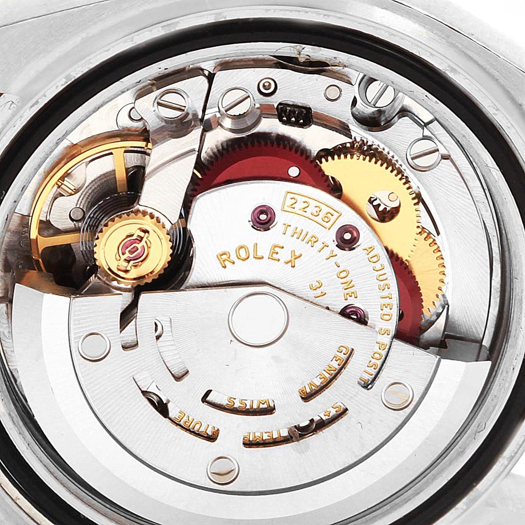 The image shows the inner mechanical movement of a Rolex Datejust 279171 Women's Steel and Gold (two tone) Green Dial 279171 Women's Steel and Gold (two tone) Green Dial watch from a close-up angle, highlighting gears and components.