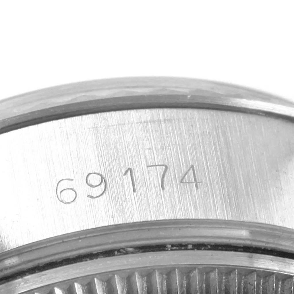 Shown here is a close-up view of the case-side of the Rolex Datejust 69174 Women
s Stainless Steel Silver Dial 69174 Women
s Stainless Steel Silver Dial watch, specifically highlighting the model number 69174.