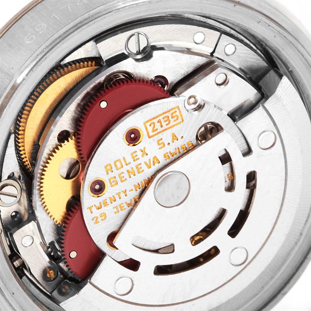 This image shows a close-up of the movement mechanism inside a Rolex Datejust 69174 Women
s Stainless Steel Silver Dial 69174 Women
s Stainless Steel Silver Dial watch.
