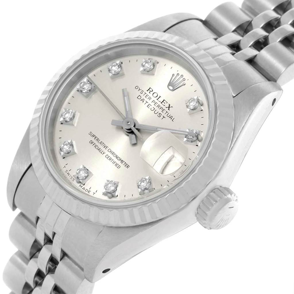The image shows a close-up of the Rolex Datejust 69174 Women
s Stainless Steel Silver Dial 69174 Women
s Stainless Steel Silver Dial watch face, crown, and partial bracelet at an angled view.