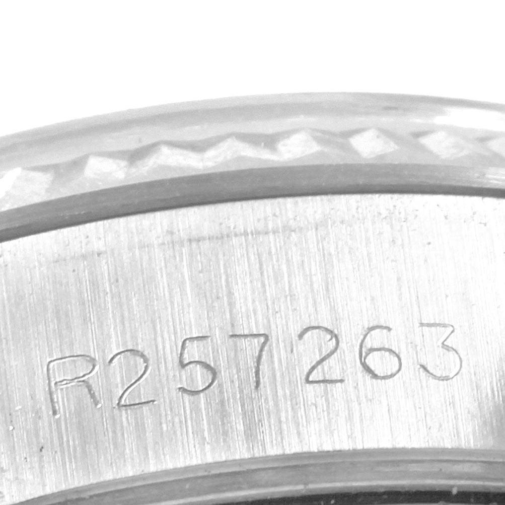 The image shows a close-up of the serial number on the case side of a Rolex Datejust 69174 Women
s Stainless Steel Silver Dial 69174 Women
s Stainless Steel Silver Dial watch model.
