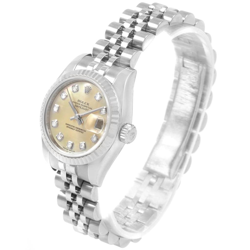 This image shows a Rolex Datejust 179174 Women
s Stainless Steel Mother of Pearl Dial 179174 Women
s Stainless Steel Mother of Pearl Dial watch at an angle highlighting the dial, bezel, crown, and bracelet.
