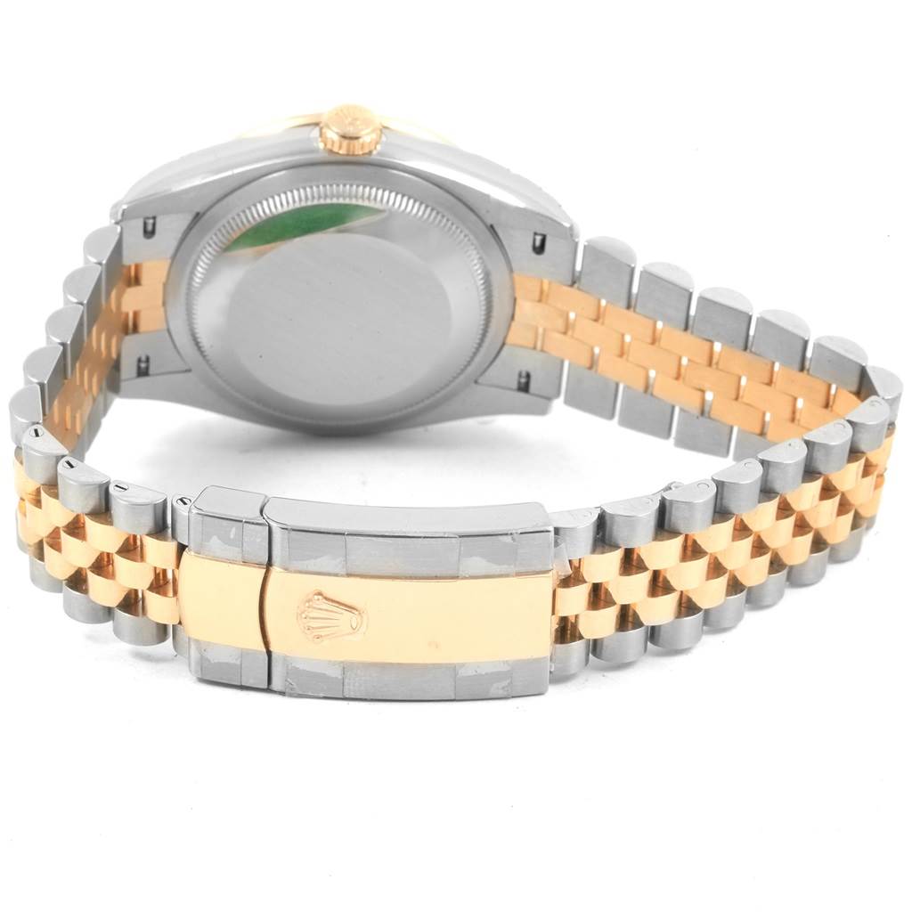 The image shows the back of a Rolex Datejust 126283 Women's Steel and Gold (two tone) Green Dial 126283 Women's Steel and Gold (two tone) Green Dial watch, highlighting its clasp, bracelet links, and case back.