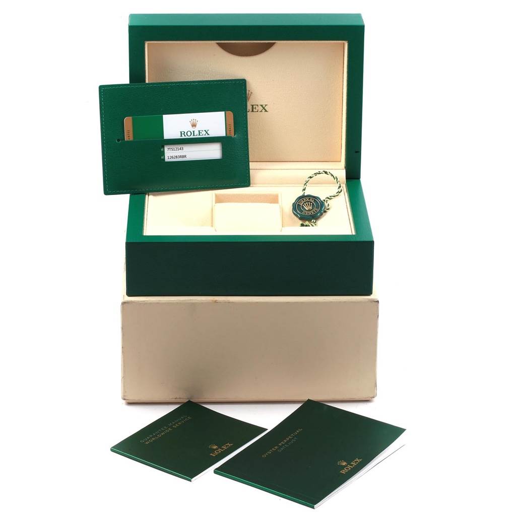 The image shows an open Rolex Datejust 126283 Women's Steel and Gold (two tone) Green Dial 126283 Women's Steel and Gold (two tone) Green Dial watch box, warranty card, tag, and manuals, all accessories.