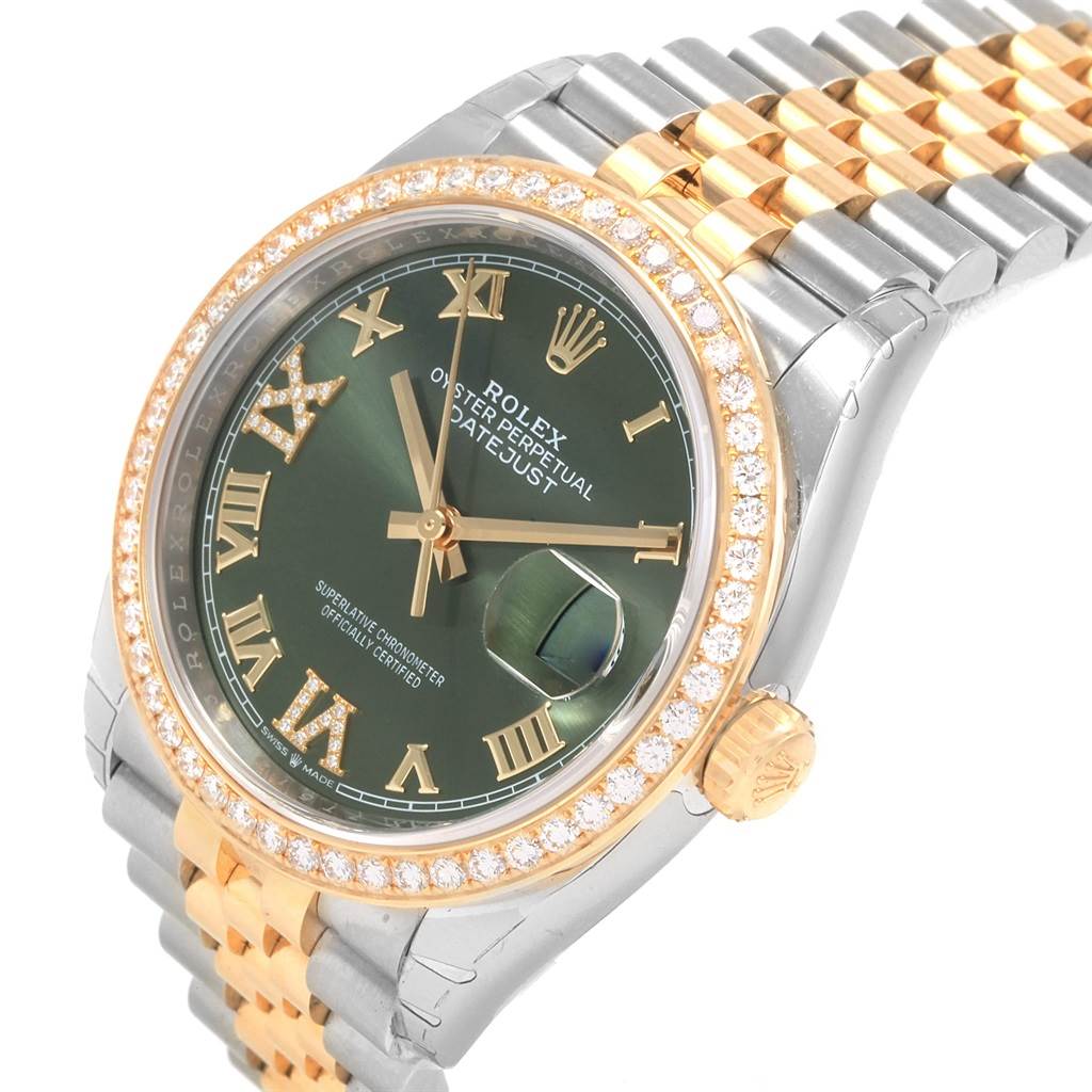 The Rolex Datejust 126283 Women's Steel and Gold (two tone) Green Dial 126283 Women's Steel and Gold (two tone) Green Dial watch is shown from an oblique angle, displaying the face, bezel, and bracelet.