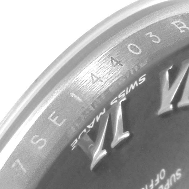 The image shows a partial close-up of the bezel and dial of a Rolex Datejust 7SE14403 Women
s Stainless Steel Grey Dial 7SE14403 Women
s Stainless Steel Grey Dial watch.