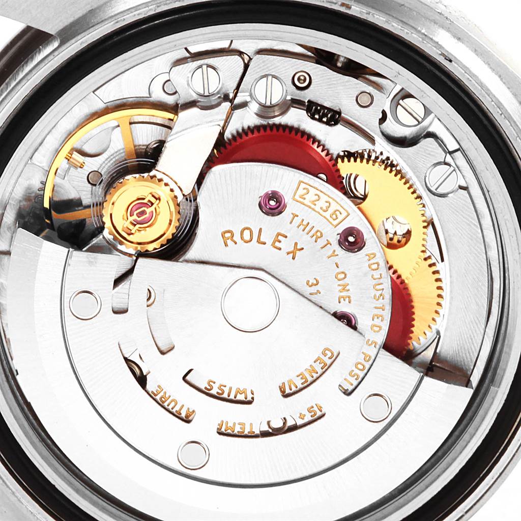 This image shows a close-up view of the inner mechanical movements and parts of a Rolex Datejust 7SE14403 Women
s Stainless Steel Grey Dial 7SE14403 Women
s Stainless Steel Grey Dial watch.