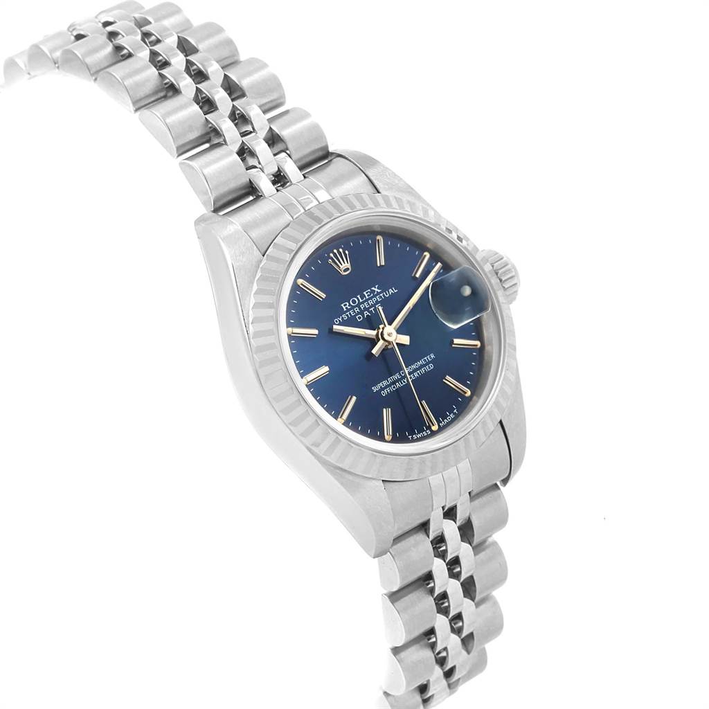 The image shows a Rolex Datejust 69174 Women
s Stainless Steel Blue Dial 69174 Women
s Stainless Steel Blue Dial watch at a slight angle, highlighting its blue dial, fluted bezel, and Jubilee bracelet.