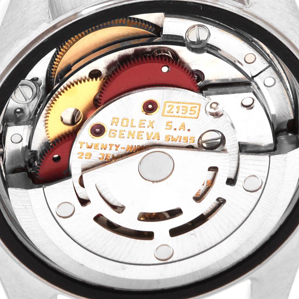 This image shows the internal mechanical movement of a Rolex Datejust 69174 Women
s Stainless Steel Blue Dial 69174 Women
s Stainless Steel Blue Dial watch, highlighting gears and engraved components.