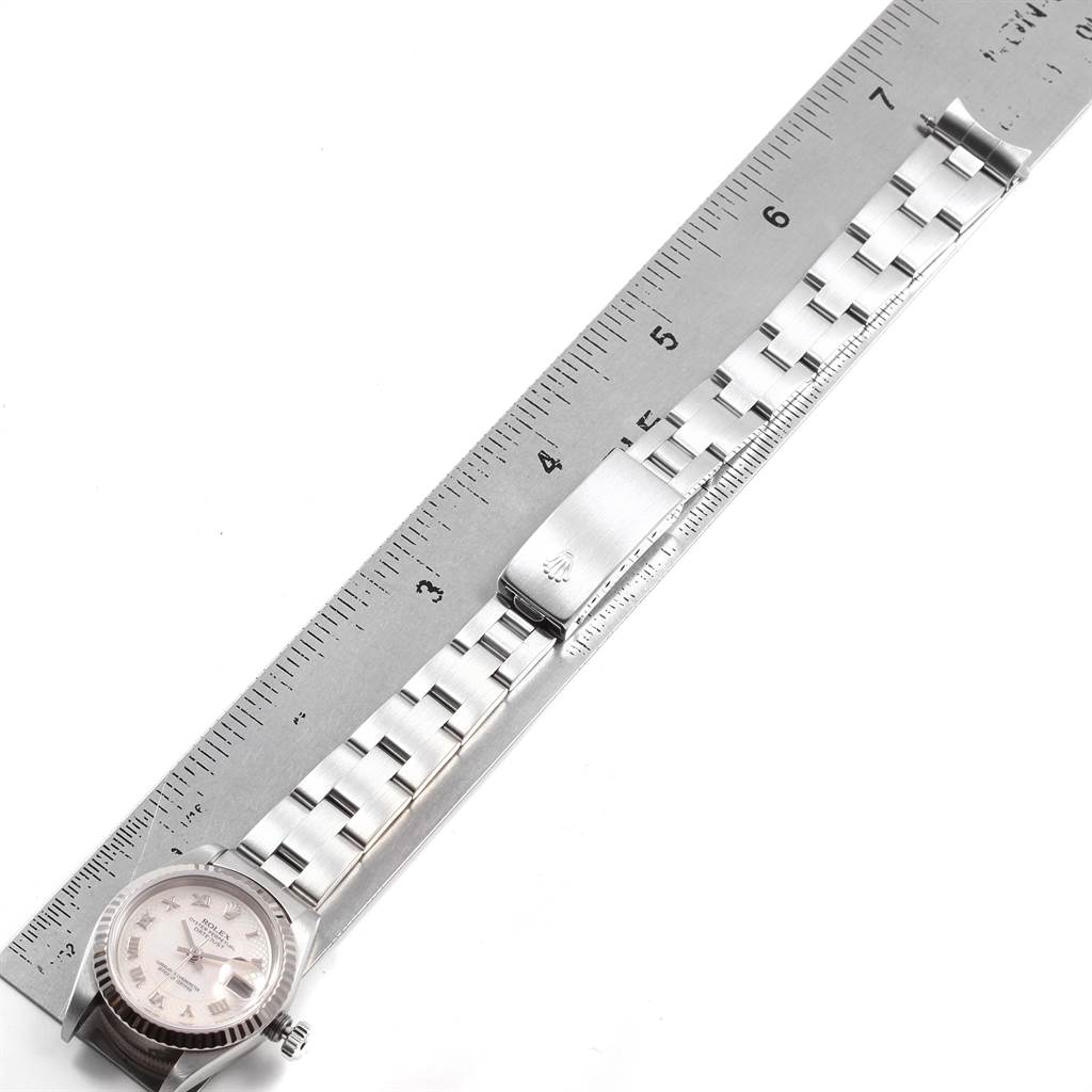 The image shows a Rolex Datejust 69174 Women's Stainless Steel Mother of Pearl Dial 69174 Women's Stainless Steel Mother of Pearl Dial watch laid flat next to a ruler, highlighting the full length of its band and clasp.