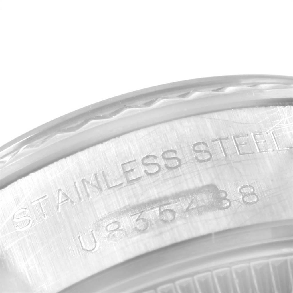This image shows an extreme close-up of the case back with engraving on a Rolex Datejust 69174 Women's Stainless Steel Mother of Pearl Dial 69174 Women's Stainless Steel Mother of Pearl Dial stainless steel watch.