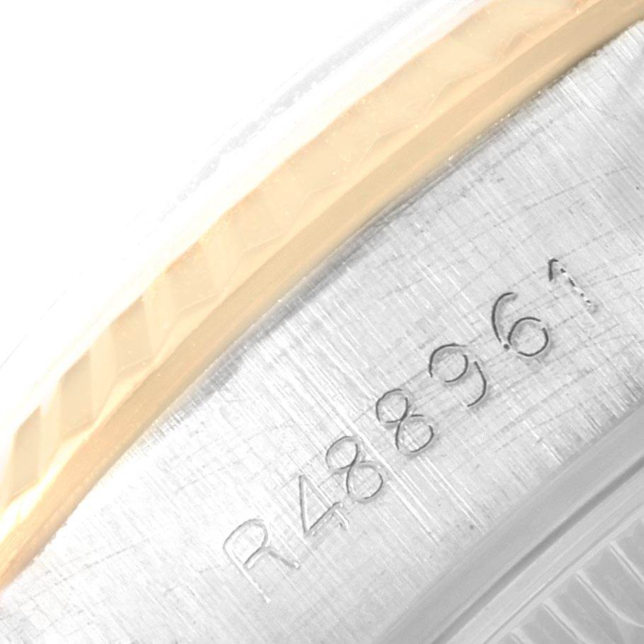 This close-up photo shows the serial number on the steel case back of a Rolex Datejust 69173 Women's Stainless Steel Champagne Dial 69173 Women's Stainless Steel Champagne Dial watch.