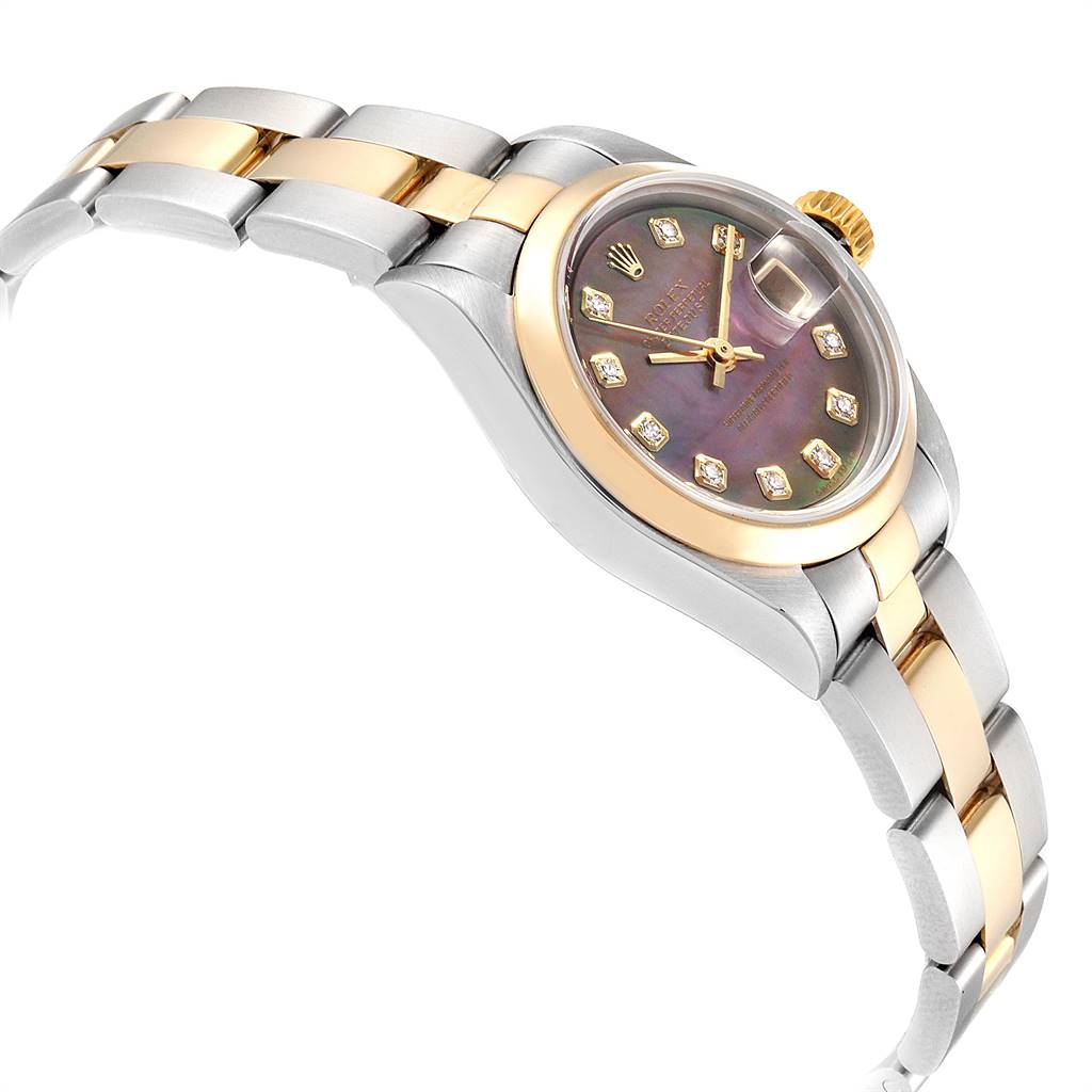 The image shows a side angle of a Rolex Datejust 79163 Women's Steel and Gold (two tone) Mother of Pearl Dial 79163 Women's Steel and Gold (two tone) Mother of Pearl Dial watch, highlighting the bracelet and crown with a portion of the dial.
