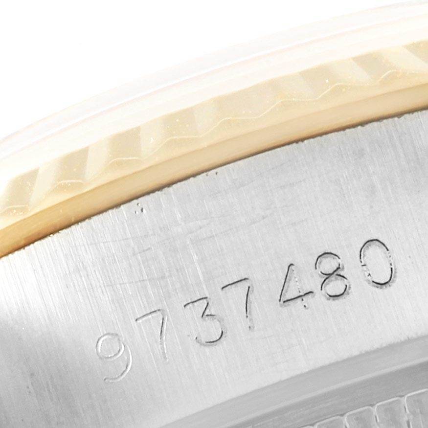 This close-up image shows the serial number engraving on the side of a Rolex Datejust 69173 Women's Stainless Steel Champagne Dial 69173 Women's Stainless Steel Champagne Dial model.
