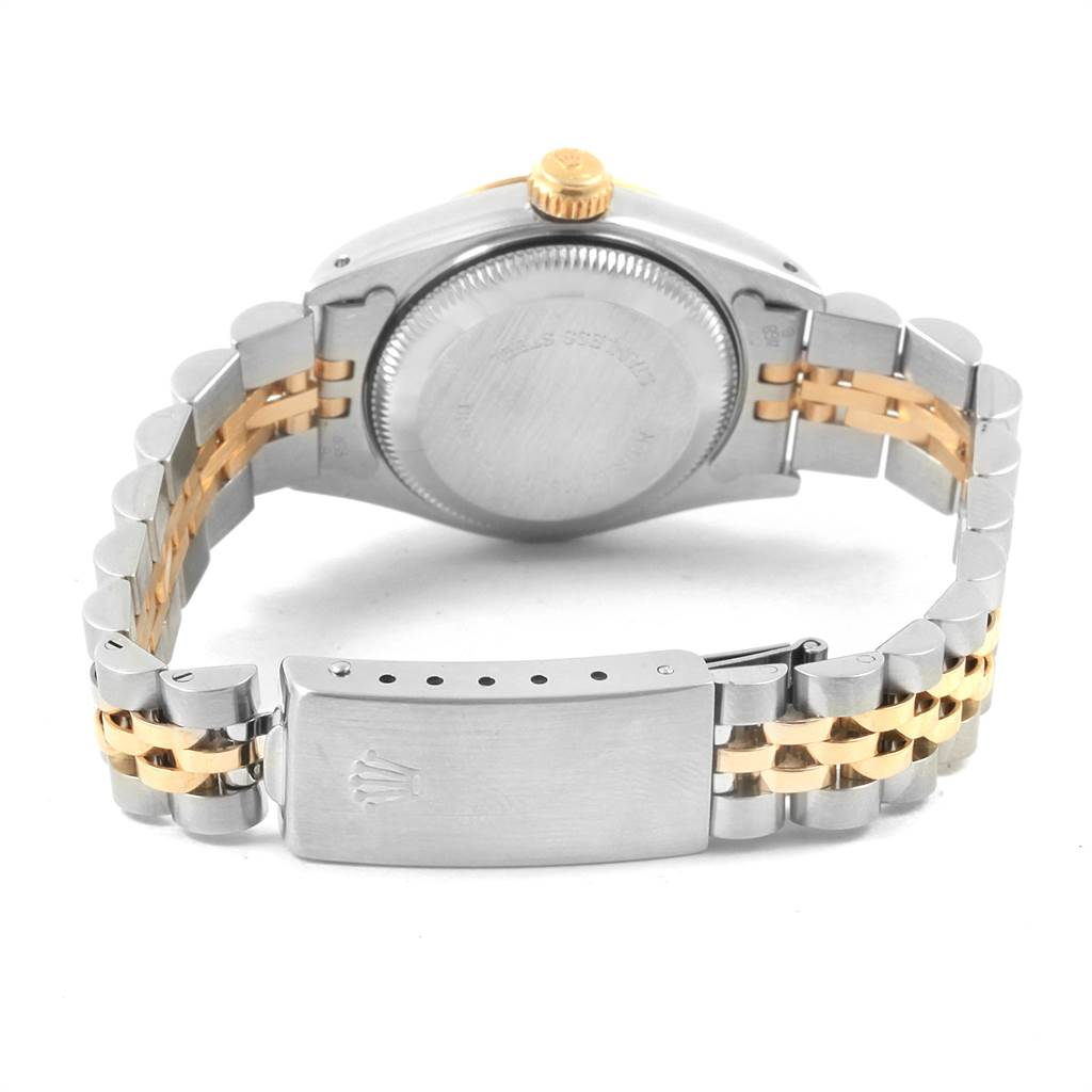 This image shows a rear view of a Rolex Datejust 69173 Women's Stainless Steel Champagne Dial 69173 Women's Stainless Steel Champagne Dial, highlighting the case back, crown, and two-tone bracelet with the clasp.
